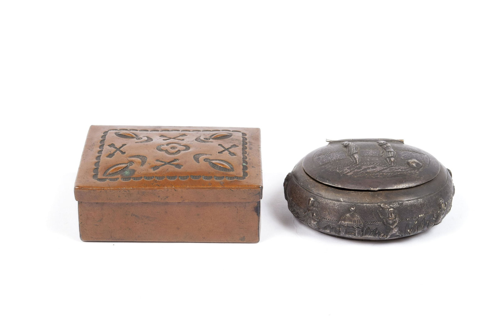 TWO AMERICAN BOXES: TWO AMERICAN BOXES Diminutive rectangular copper Navajo box having hand hammered repousse decoration, together with a Central/South American repousse decorated snuff box. Copper box: 1" height, 3" wid