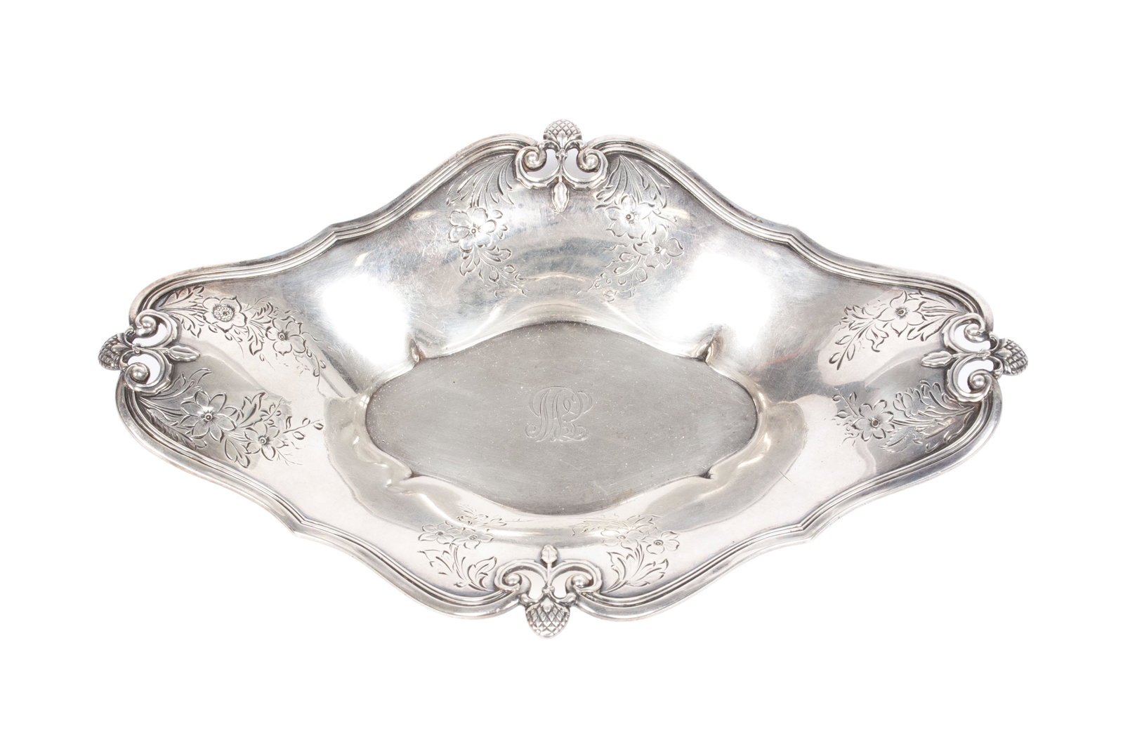 DIMINUTIVE BOWL BY TIFFANY: DIMINUTIVE BOWL BY TIFFANY American, ca.1907, John C. Moore II period (1907-1947). Sterling silver bowl with etched floral designs and four pierced scrolling corners with strawberry form finials. Bott