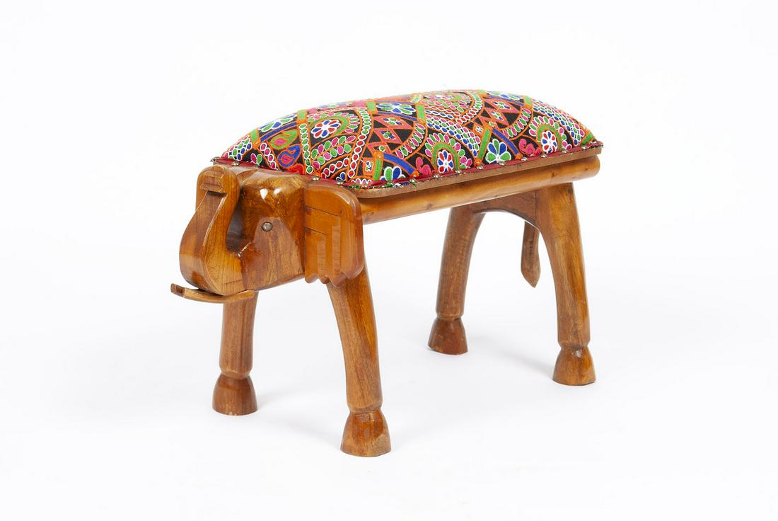 MODERN STOOL: MODERN STOOL Carved wooden elephant form with colorful padded seat. 17.5" height, 27" width, 12" depth.