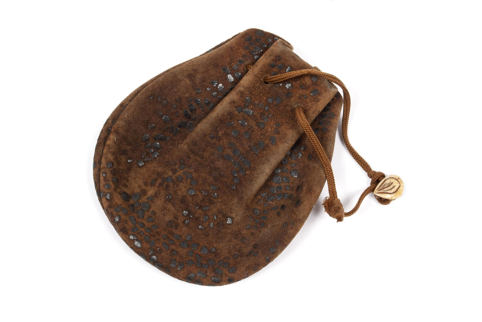 JAPANESE RAY SKIN TOBACCO POUCH: JAPANESE RAY SKIN TOBACCO POUCH Late 19th/early 20th century, ray skin pouch having replaced chording with bone netsuke. 3.5" width, 4" height