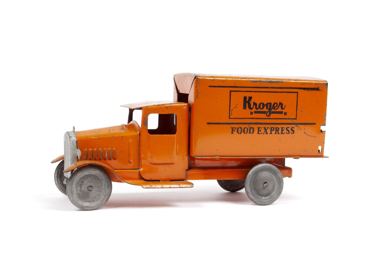METALCRAFT CORP. "KROGER - FOOD EXPRESS" TOY TRUCK: METALCRAFT CORP. "KROGER - FOOD EXPRESS" TOY TRUCKPressed steel, ca.1930s. Orange with silvered grill and wheels with advertising to the side of the box. Signed "Metalcraft Corp - St. Louis" to the bo