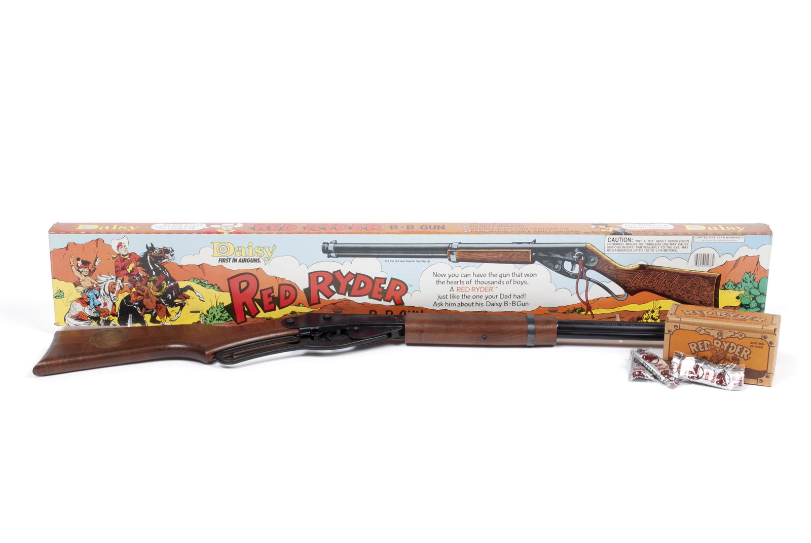 DAISY RED RYDER BB GUN IN ORIGINAL BOX: DAISY RED RYDER BB GUN IN ORIGINAL BOX American, late 20th century, model 1938 B. Very good original condition with "Red Ryder Jr. Treasure Chest" of ammo included.