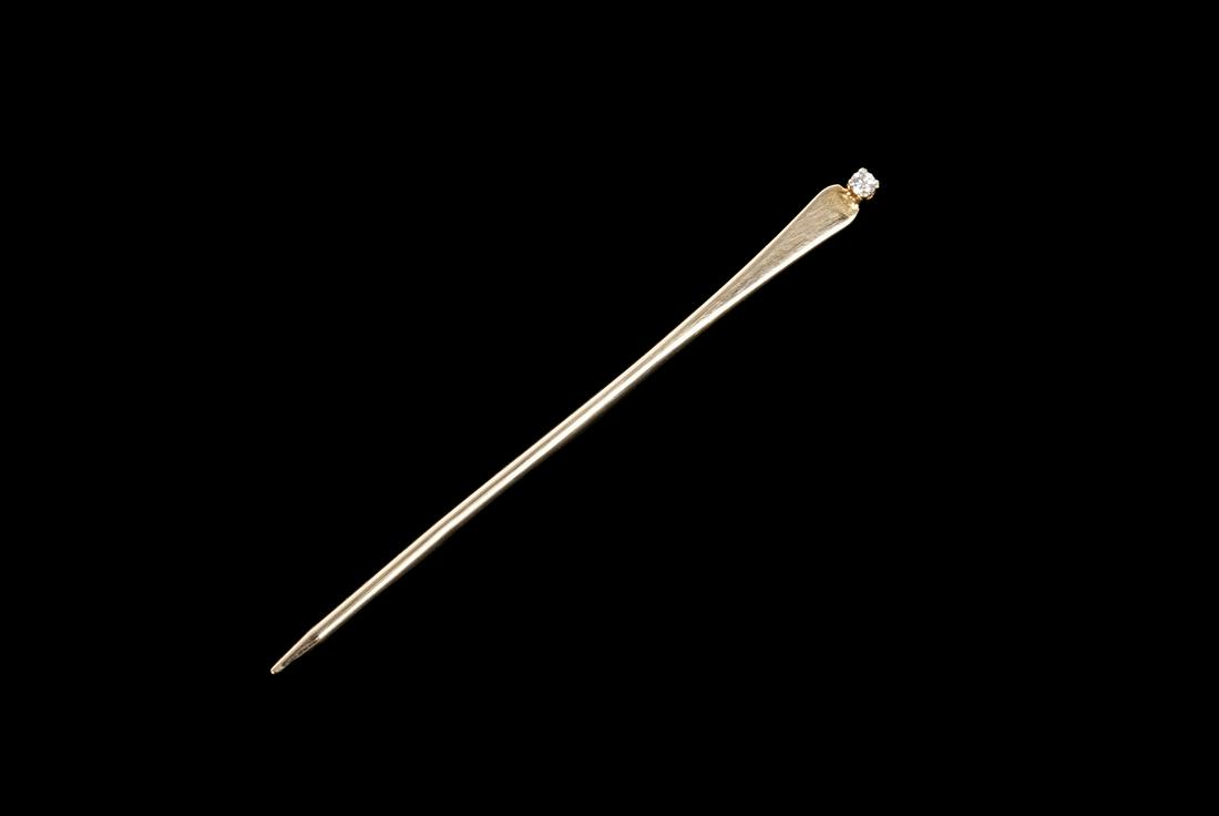 DIAMOND MOUNTED GOLD TOOTHPICK: A 14k yellow gold and diamond toothpick with leather pouch., 2 grams, 2" length