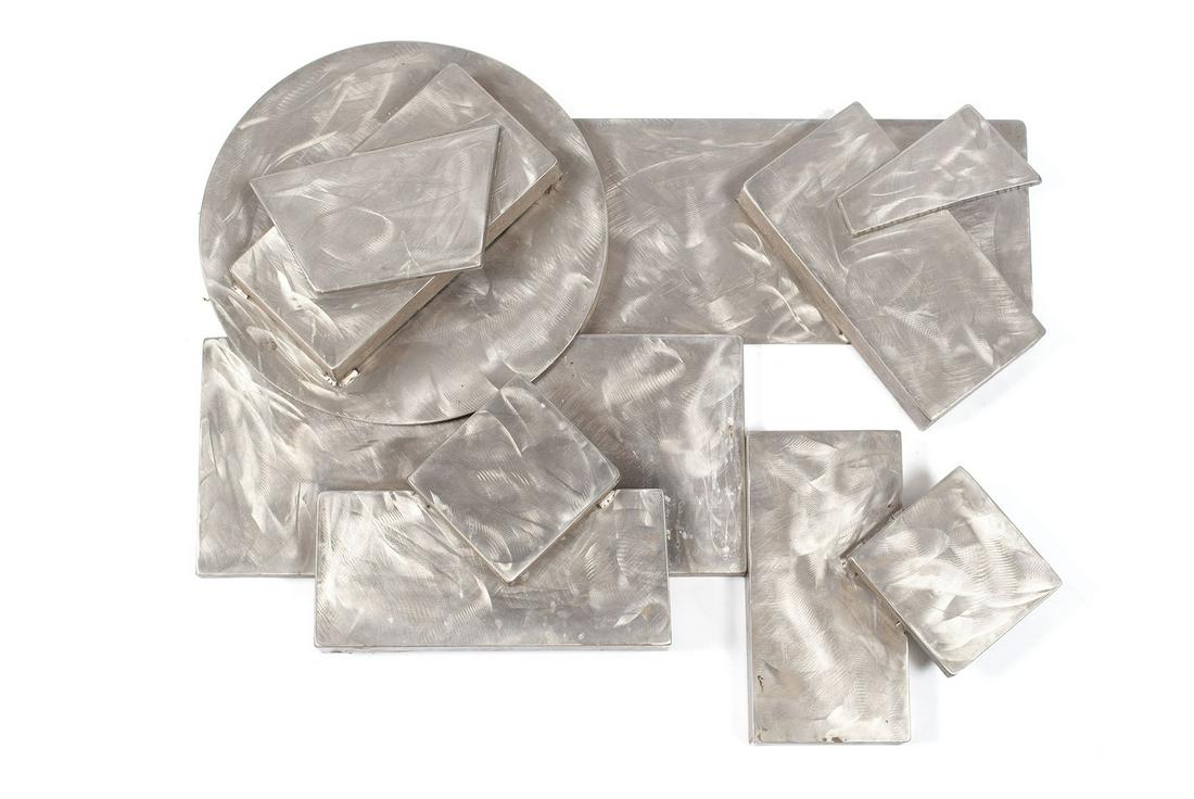 LARRY POGUE (AMERICAN, 20TH CENTURY): LARRY POGUE (AMERICAN, 20TH CENTURY) Shiny Caboose Wall sculpture, stainless steel, signed and titled to lower edge. Missouri artist. 28" height, 34" width, 3" depth