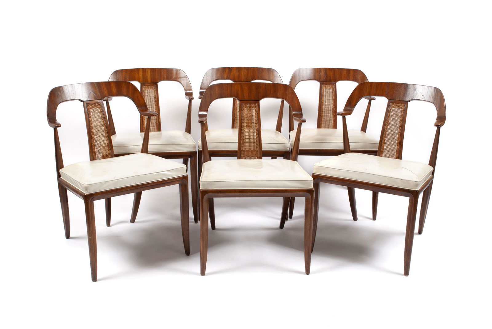 SIX MICHAEL TAYLOR FOR TOMLINSON SOPHISTICATE DINING: SIX MICHAEL TAYLOR FOR TOMLINSON SOPHISTICATE DINING CHAIRSAmerican, mid-century. Curved crests with woven wicker splats, white leather seats with stamped design, and slightly sabered legs. 31" height