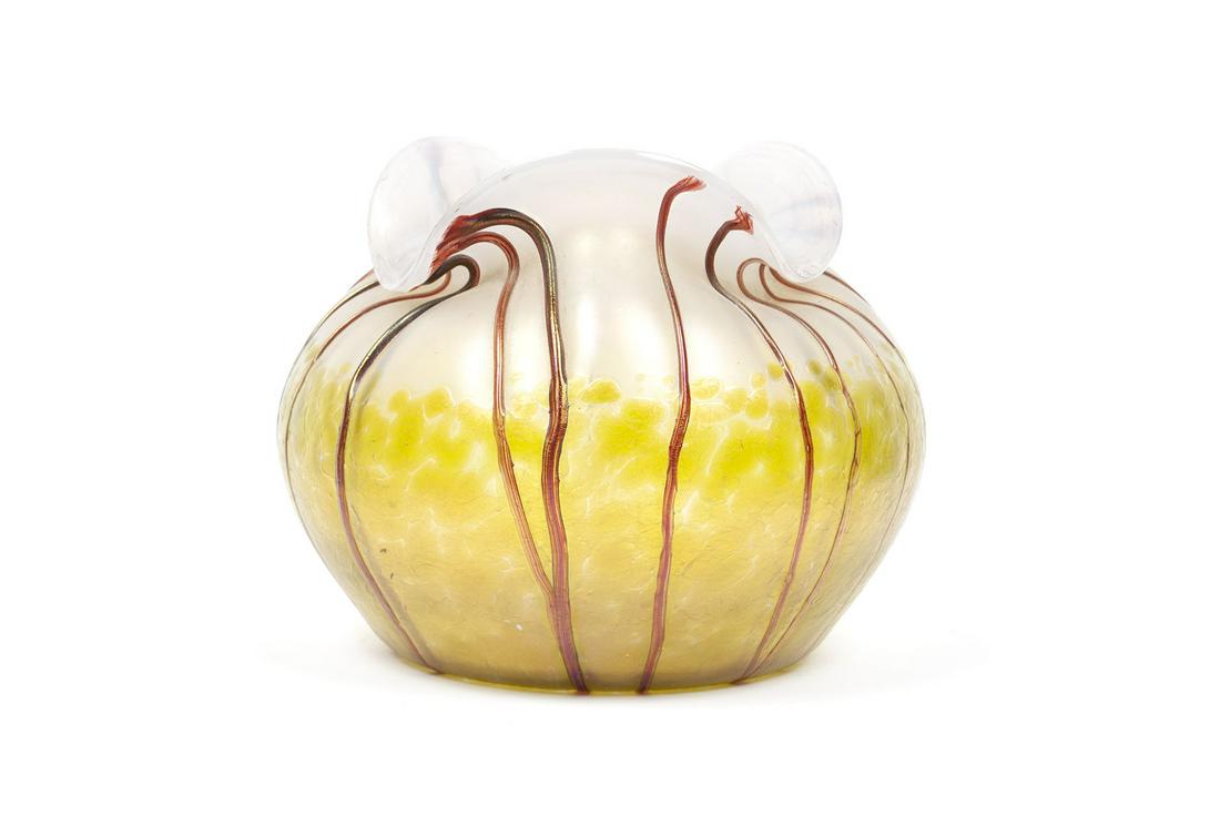 ART GLASS VASE IN THE MANNER OF LOETZ: ART GLASS VASE IN THE MANNER OF LOETZIn the Crete Papillon style. Rotund shape, iridescent, milky glass with flaring lip, raised auburn striping and textured, mottled green overlay rising from the bas