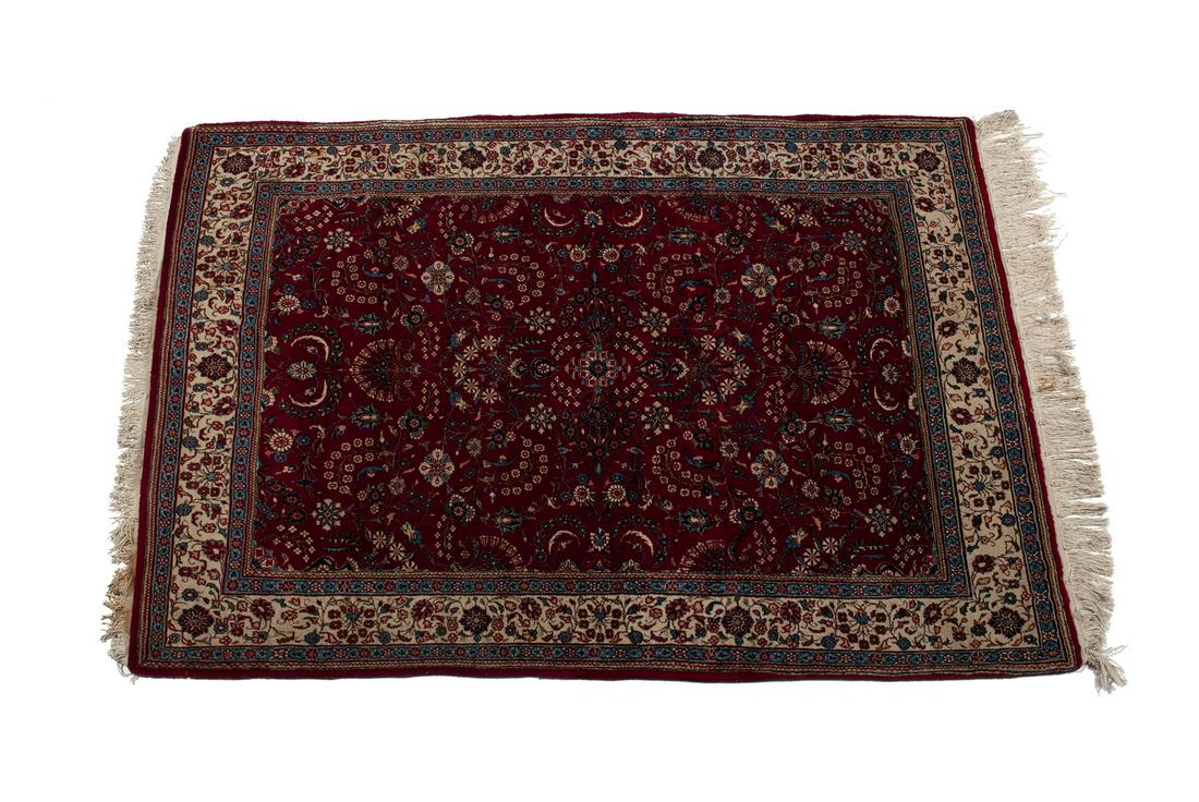MASHAD AREA RUG: MASHAD AREA RUG Persian, 3rd quarter 20th century. Floral decorated red field, ivory border with foliate guard borders. 6' 7" length, 4' 8" width
