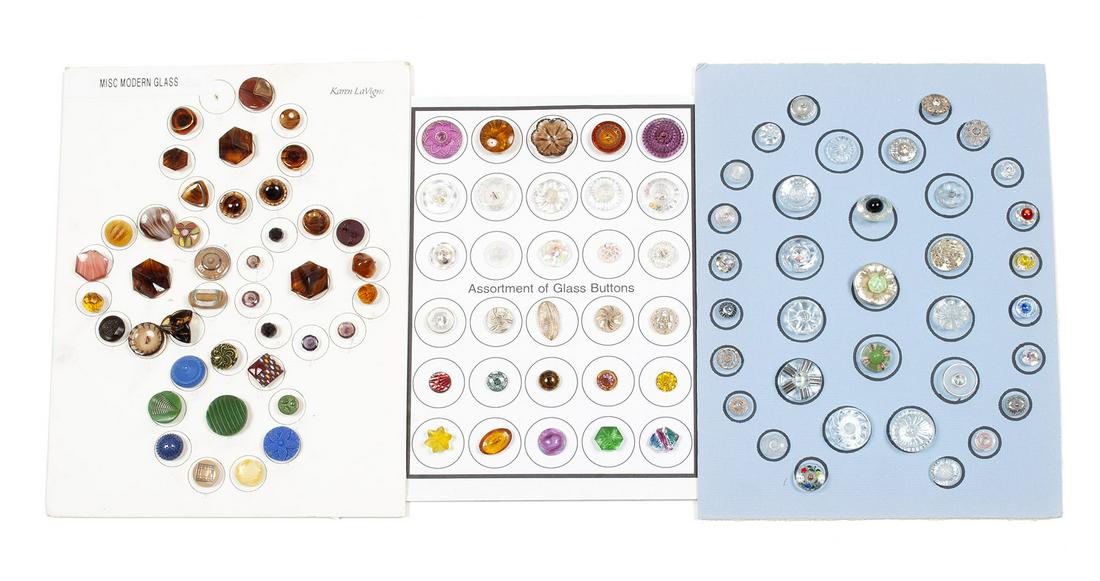 COLLECTION OF COLORED GLASS BUTTONS: COLLECTION OF COLORED GLASS BUTTONS One hundred four (104) individual buttons on three (3) mostly completed cards of underrated glass buttons consisting of Czech, West German, Continental, enameled, c