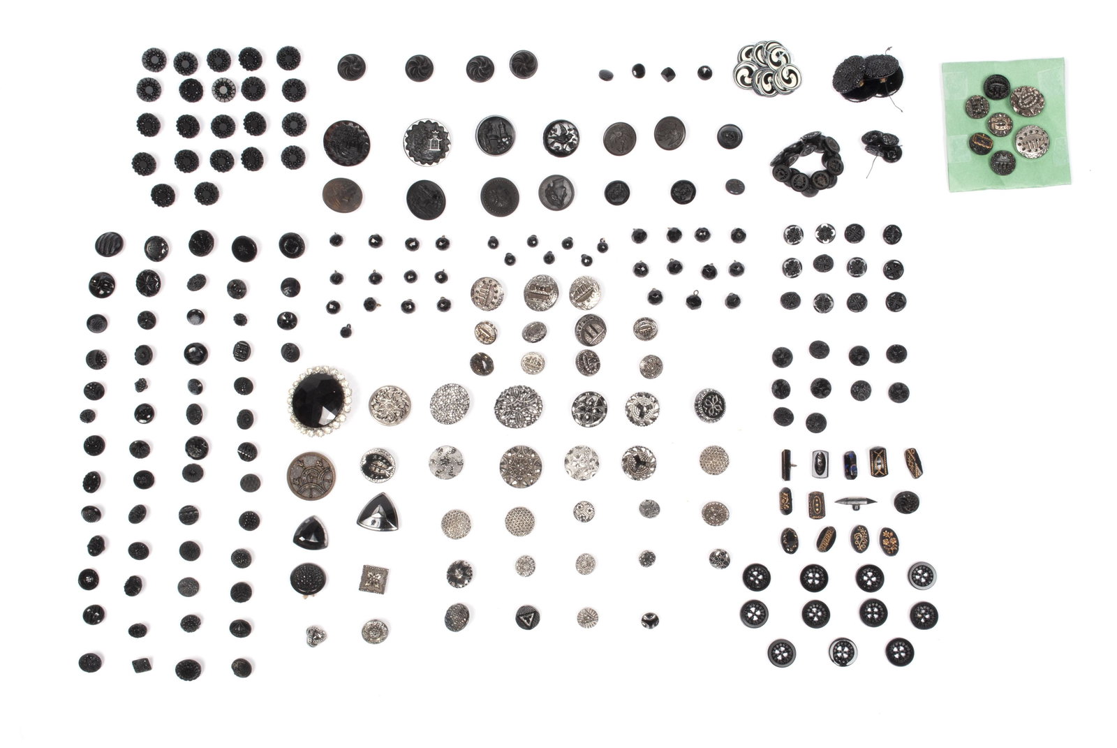 COLLECTION OF BLACK JET AND BLACK GLASS BUTTONS -: COLLECTION OF BLACK JET AND BLACK GLASS BUTTONS - MAINLY PAIRS AND SETS Dozens of examples of black glass and jet, marcasite, and more.