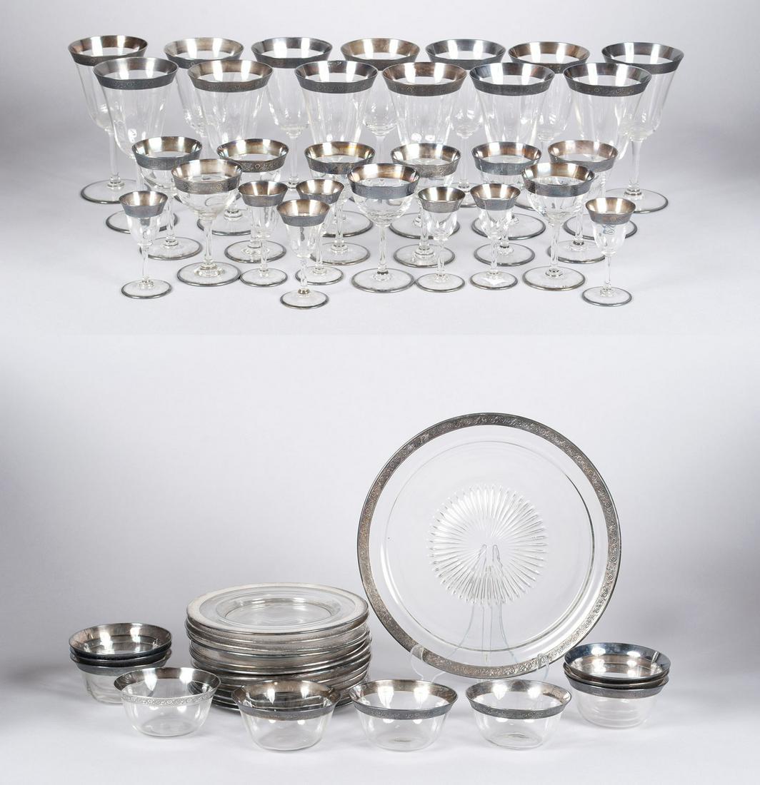 SET OF STERLING-OVERLAY STEMWARE AND BOWLS: SET OF STERLING-OVERLAY STEMWARE AND BOWLS Pressed floral design to sterling rims, consisting of thirteen wine glasses, nine cordials, seven aperitifs, ten soup bowls, eleven plates, and one serving p