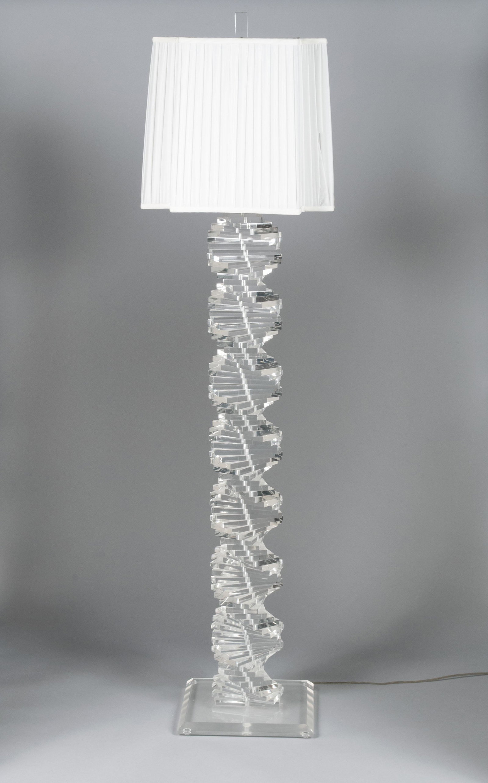 HIVO VAN TEAL (20TH CENTURY): HIVO VAN TEAL (20TH CENTURY)Late 20th century, lucite. Spiraling sculptural floor lamp, of rectangular forms spiraling upward on a rectangular base. 62" height