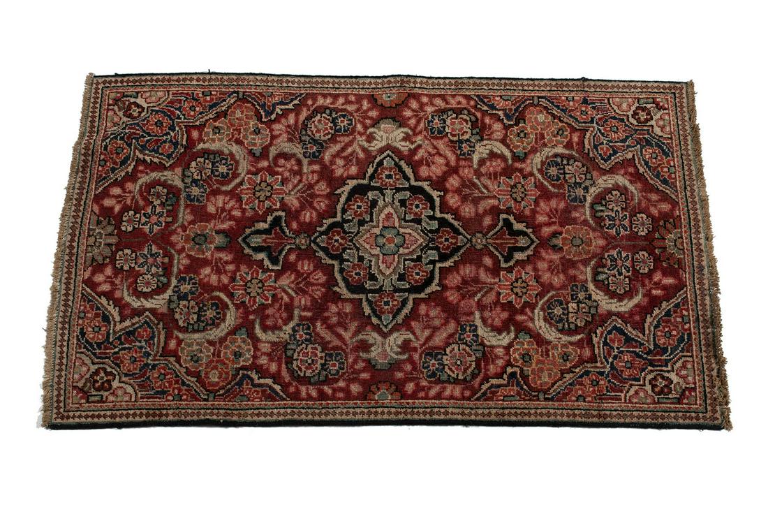 PERSIAN AREA RUG: PERSIAN AREA RUG Persian, mid-20th century. Floral bouquets in ivory and brown, decorate the red field, some dark blue highlights. 5' 8" length, 3' 4" width