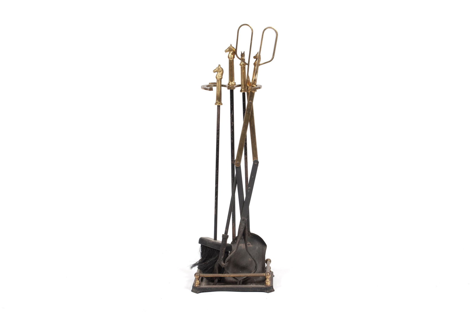 EQUESTRIAN MOTIF FIREPLACE GARNITURE: EQUESTRIAN MOTIF FIREPLACE GARNITURE Brass, with figural horse heads to each tool, horseshoe design to stand. 23.75" height of stand