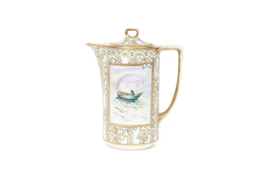 NORITAKE CHOCOLATE POT: NORITAKE CHOCOLATE POT Japan, early 20th century, porcelain. Single panel of boat paddler surrounded by raised applied floral patterning. 8.25" height