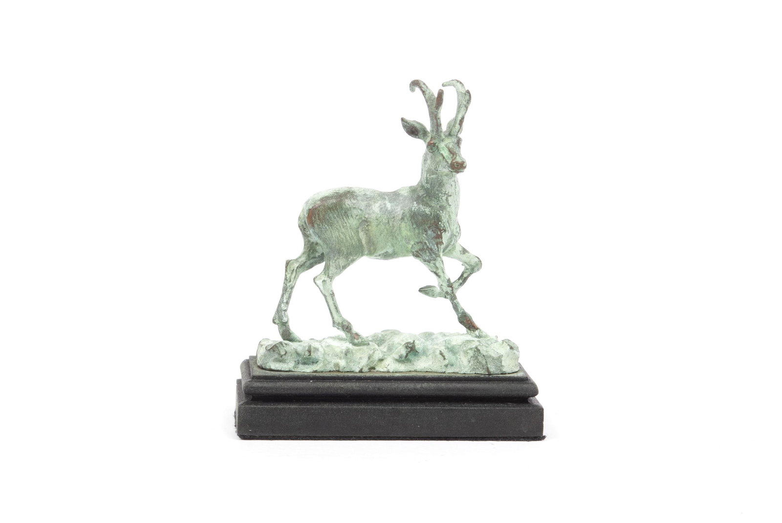 DANIEL PHILLIP KRONBERG MINIATURE BRONZE GOAT: DANIEL PHILLIP KRONBERG MINIATURE BRONZE GOAT Prairie Sprinter Patinated bronze statuette bearing "DK" signature to base, of full-bodied and posed ibex. 4.5 centimeters in height