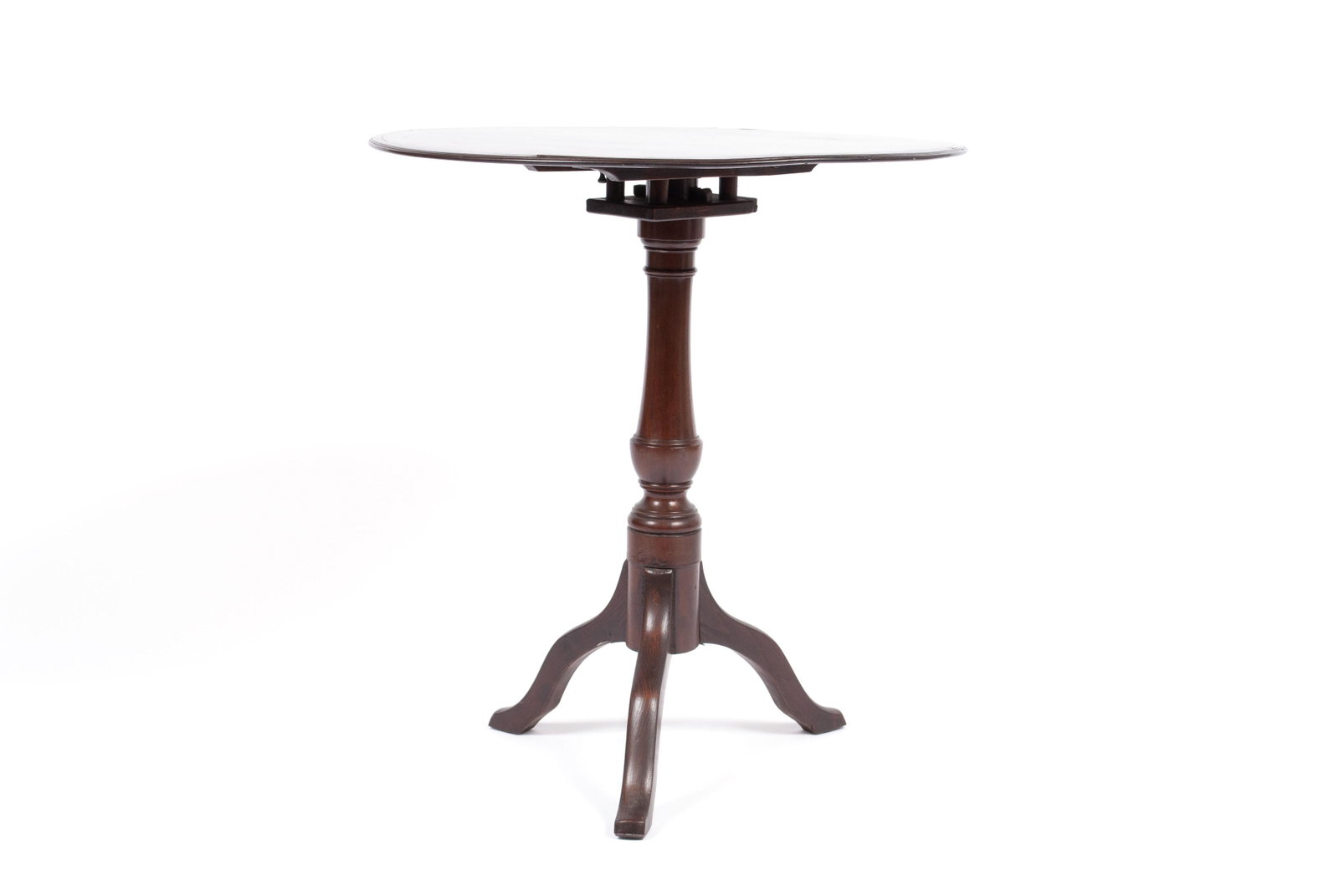 TILT TOP TEA TABLE: TILT TOP TEA TABLE American, 19th century. Crossbanded circular top on turned pedestal support and tripod base.