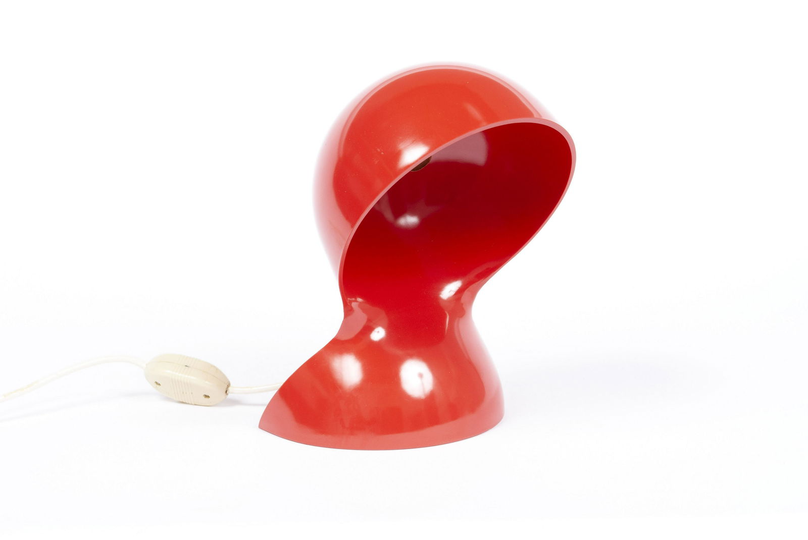 DALU LAMP DESIGNED BY VICO MAGISTRETTI FOR ARTEMIDE: DALU LAMP DESIGNED BY VICO MAGISTRETTI FOR ARTEMIDEItaly, mid-century. Vibrant red plastic in twisted and cut spherical form. 10" height