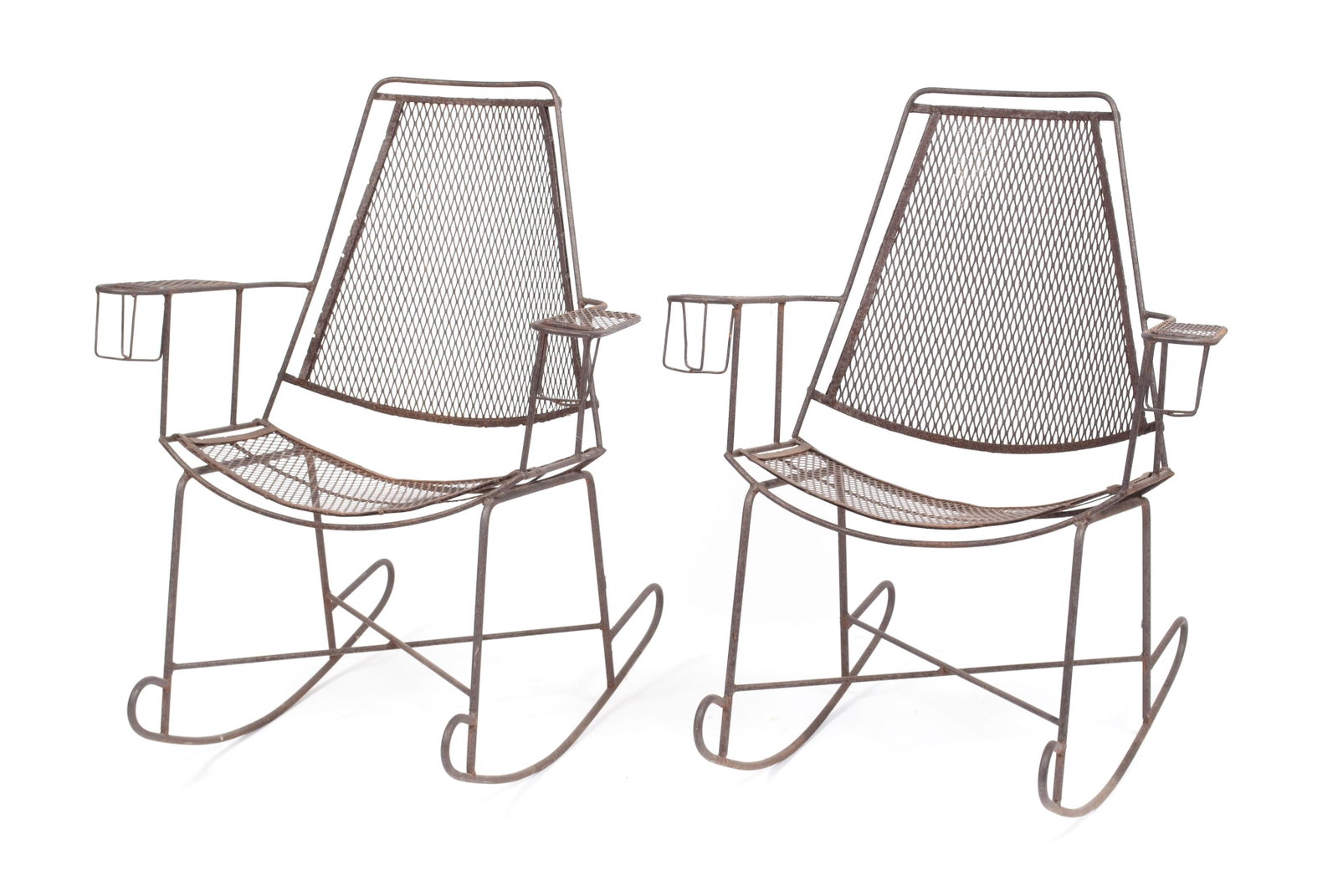 PAIR OF MID CENTURY SALTERINI STYLE WROUGHT IRON: PAIR OF MID CENTURY SALTERINI STYLE WROUGHT IRON ROCKERS American, mid-20th century, iron. The lattice work back and seat flanked by cupholder arms and terminating on bent iron rockers. 38" height, 29