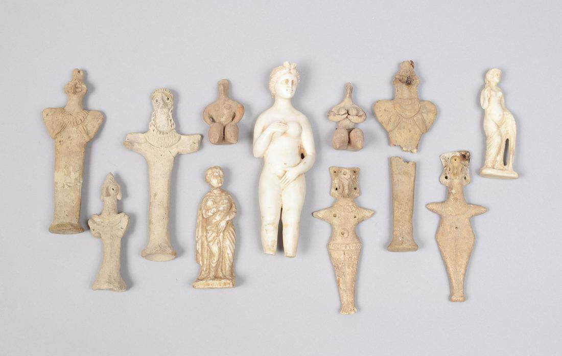 COLLECTION OF ANTIQUITIES: COLLECTION OF ANTIQUITIES Continental. Two white marble figures of nude women, the largest with no feet. Together with several earthenware figural pieces, some with imperfections. Largest 7.3" height
