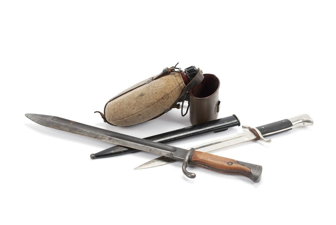 TWO GERMAN BAYONETS TOGETHER WITH A CANTEEN: TWO GERMAN BAYONETS TOGETHER WITH A CANTEEN Twentieth century, a Horst Wolff, Liepzig C1 G.M.B.H dress/fireman's bayonet, a Waffen Fabrik Mauser AG WW1 era bayonet, and an M42 canteen.