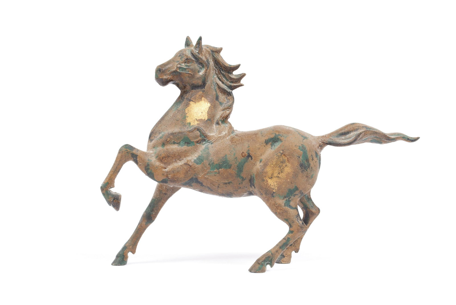 CAST IRON HORSE FIGURE: CAST IRON HORSE FIGUREDynamic tabletop figure of rearing horse with flowing tail and mane, patina and gilt traces across the form. 10" height