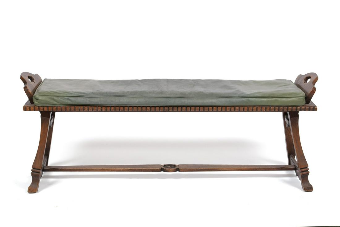 ROMWEBER LEATHER BENCH: ROMWEBER LEATHER BENCH American, mid-century, "Viking Oak". Seafoam green leather seat with handled ends, carved accents, trestle base. 21.75" height, 54" length
