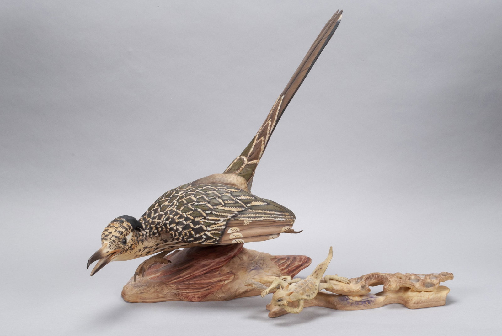 BOEHM ROAD RUNNER & HORNED TOAD: BOEHM ROAD RUNNER & HORNED TOAD American, bisque. Limited edition 493, pairing of bird in pursuit of lizard on a desert terrain. Roadrunner: 14" height, 16" length
