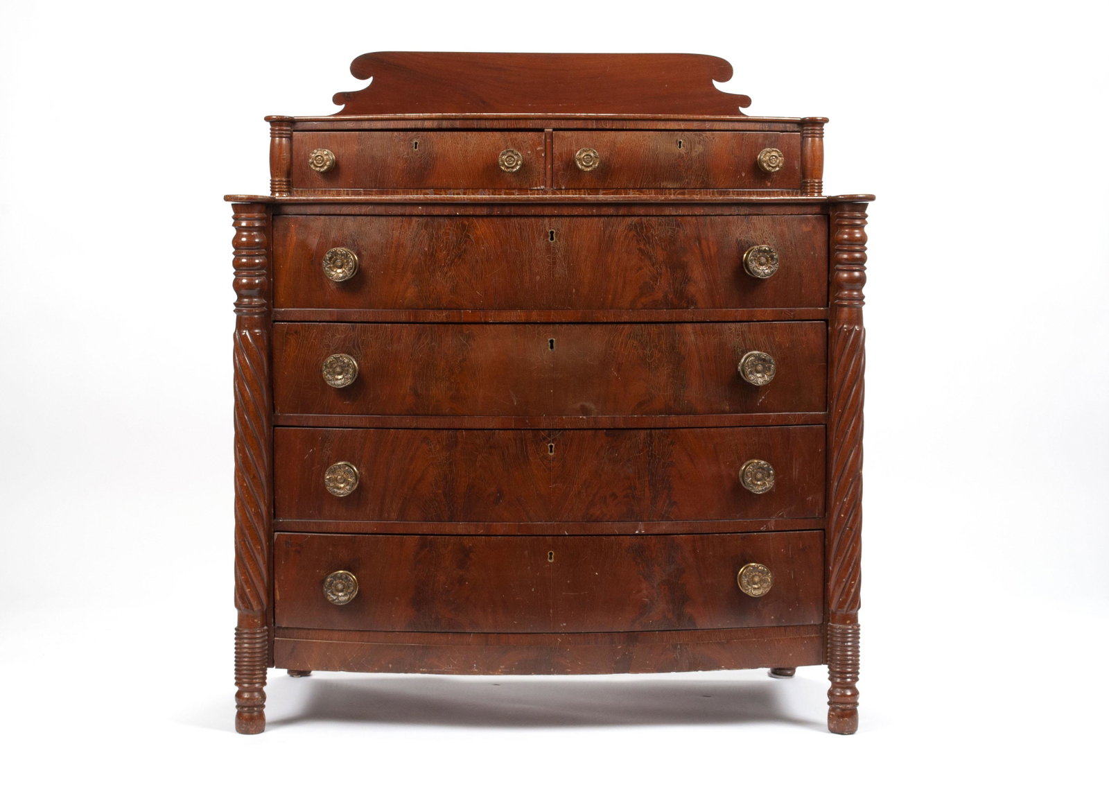 LATE FEDERAL MAHOGANY CHEST OF DRAWERS: LATE FEDERAL MAHOGANY CHEST OF DRAWERS New England, early 19th century. The stepped top with two short drawers over four long drawers, each beaded and with replaced brass knobs; the twisted 3/4 column