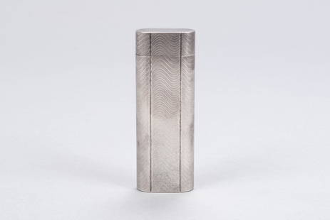 VINTAGE FRENCH CARTIER LIGHTER: VINTAGE FRENCH CARTIER LIGHTERFrance, mid-20th century. Etched wave pattern to silver toned lighter case, 5562 mark to underside, with Cartier cloth pouch. 2.75" height