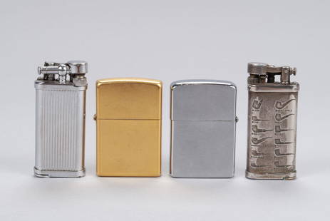 COLLECTION OF LIGHTERS: COLLECTION OF LIGHTERSMid-20th century. Two Corona Old Boy pipe lighters, one engraved with pipe forms (2.5" length), along with two vintage Zippo lighters, gold and silver toned, 2.25" length.