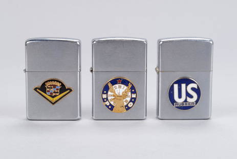 TRIO OF ADVERTISING ZIPPO LIGHTERS WITH ENAMEL EMBLEMS: TRIO OF ADVERTISING ZIPPO LIGHTERS WITH ENAMEL EMBLEMSZippo promotional lighters for US Rubber, Cadillac, and Benevolent and Protective Order of Elks.