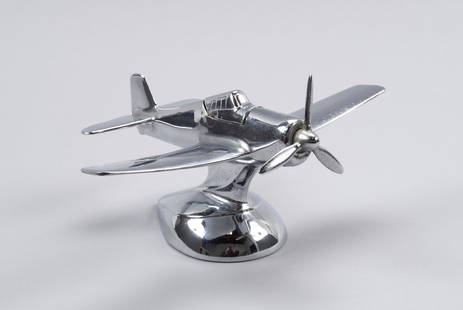 ART DECO CHROME AIRPLANE LIGHTER: ART DECO CHROME AIRPLANE LIGHTERAmerican. 20th century. Large table/desktop figural lighter with chrome finish, the lighter cockpit opened and ignited by a turn of the propellor. 3.2" height, 5.75"