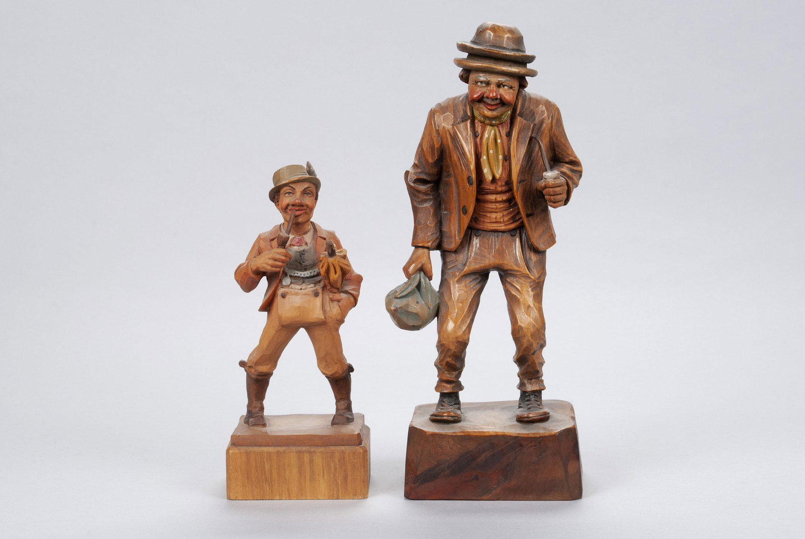 TWO POLYCHROME WOODEN FIGURES OF MEN SMOKING PIPES (1 of 5)