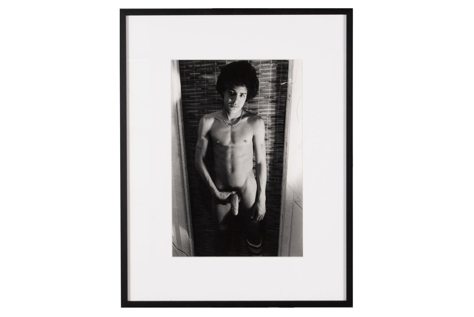 LARRY CLARK (AMERICAN, B. 1943): LARRY CLARK (AMERICAN, B. 1943)Untitled, 1978.Signed, dated, and editioned 12/25 to verso. Three-quarter length portrait of a young male nude, posing against a doorframe. Includes gallery label for Lu