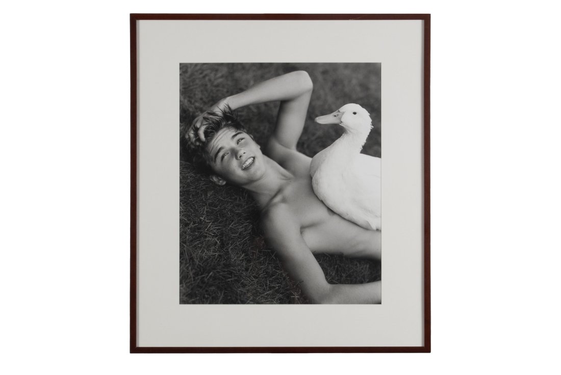 BRUCE WEBER (AMERICAN, B. 1946): John Smith and Ferdinand, Appleton Farms, MassSilver gelatin print, 2000, edition 1/10. Pencil signed, dated, and editioned to verso. Depicting a young boy reclining with a duck perched on his chest.
