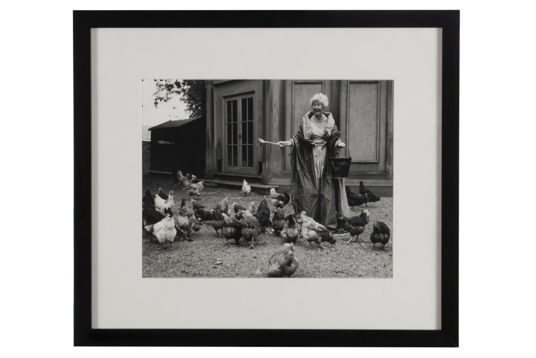 BRUCE WEBER (AMERICAN, B. 1946): The Duchess of Devonshire Feeding Her Chickens at Chatsworth , 1995, edition 5/20. Pencil signed, dated, and editioned to verso. Gelatin silver print, depicting the grinning and well-dressed Duchess s