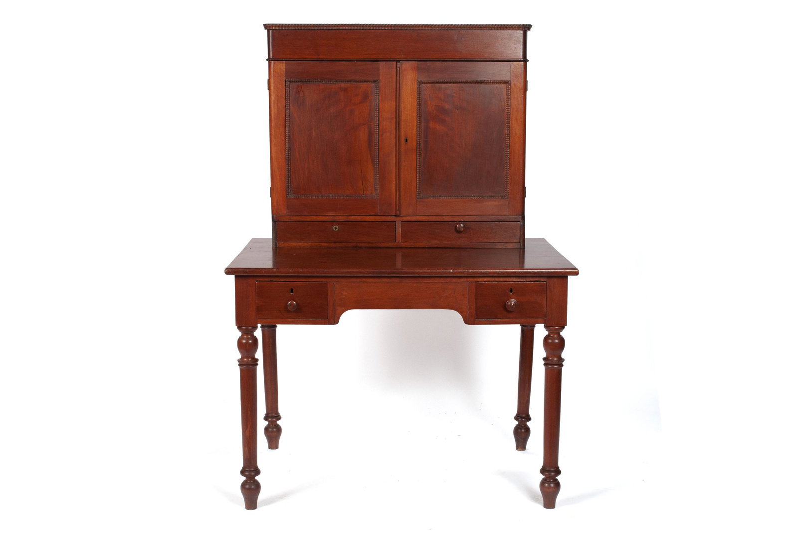 ANTIQUE AMERICAN MANAGER'S DESK: ANTIQUE AMERICAN MANAGER'S DESK American, ca. 1870, walnut. Rectangular case with panel doors covering the fitted interior of pigeon holes, with two frieze drawers below, resting on the rectangular ta