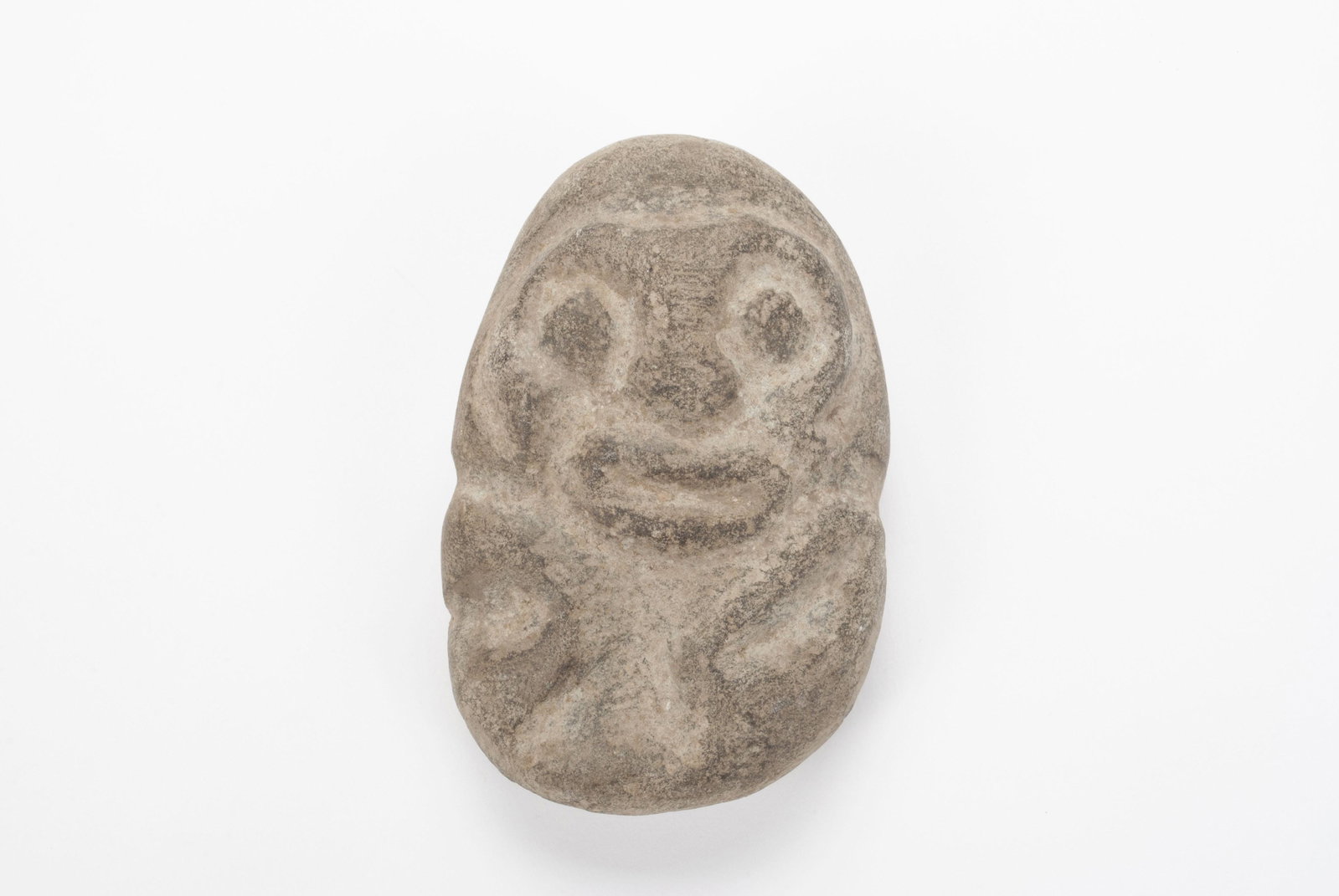 CARVED STONE TAINO ZEMI FIGURE: CARVED STONE TAINO ZEMI FIGURE Haiti, Pre-Columbian/15th C.E. style, Abstract figure of a deity . 4.25" height