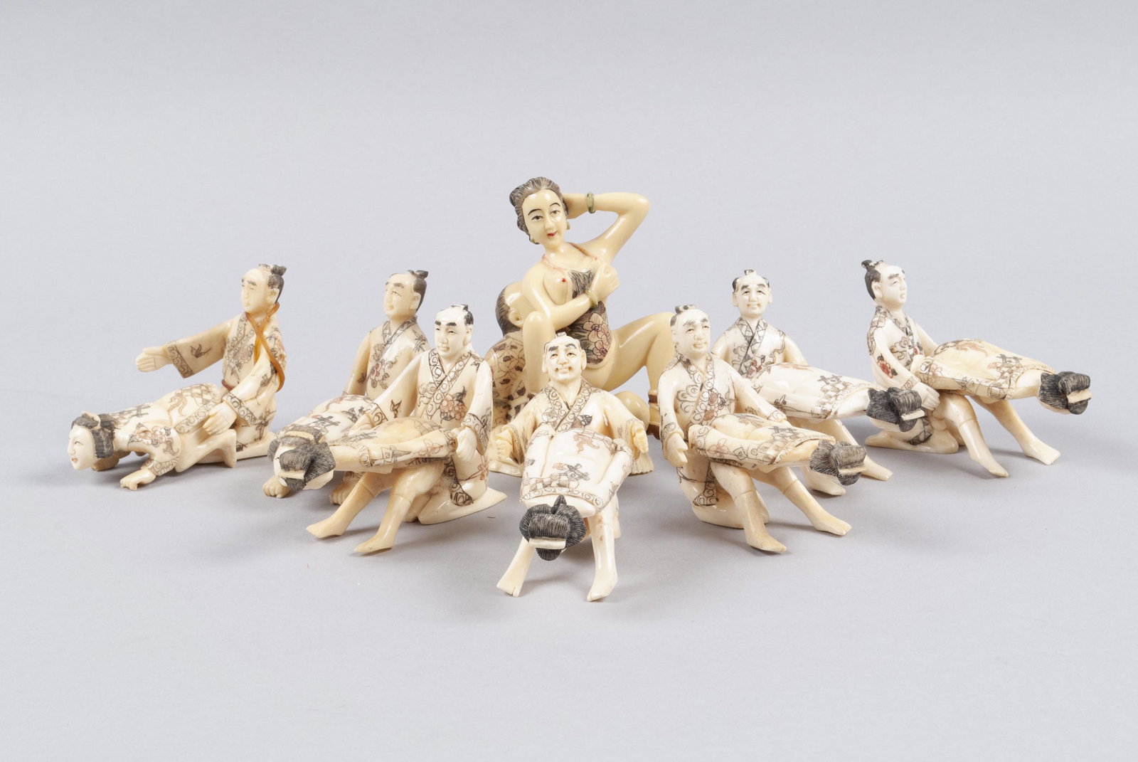COLLECTION OF EIGHT EROTIC OKIMONOS: COLLECTION OF EIGHT EROTIC OKIMONOS Japan, mid to late 20th century, faux ivory. Five identical companion sets with an additional two identical sets, and one larger set of faux ivory, marked. Largest 