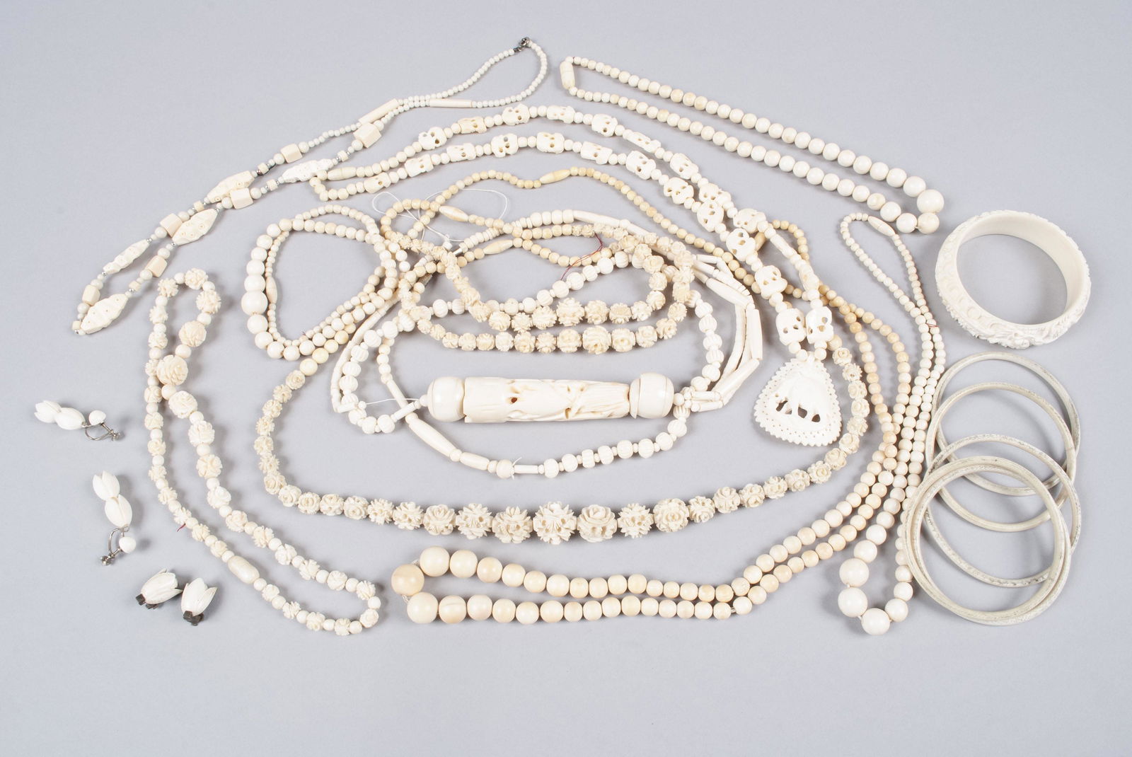 COLLECTION OF DECORATIVE ARTS AND JEWELRY: COLLECTION OF DECORATIVE ARTS AND JEWELRYTwenty-one (21) individual pieces including graduated bead necklaces, bracelet, carved bangle, earrings and more.