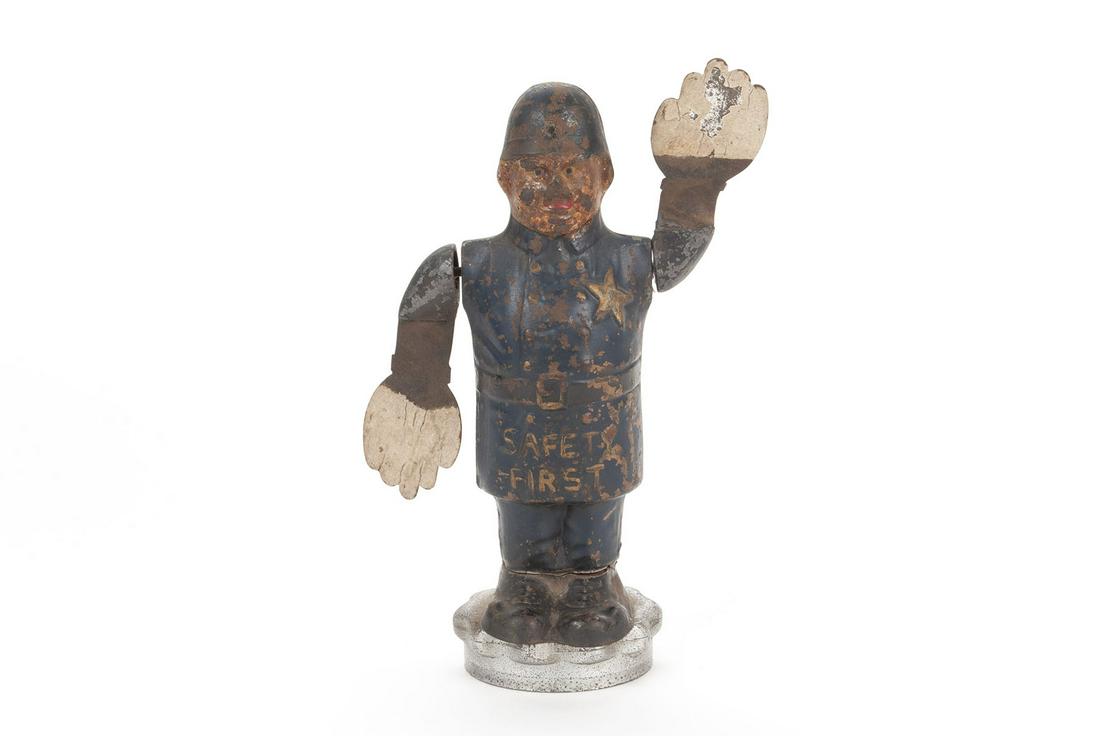 "LOUIS V. ARONSON" WHIRLIGIG "SAFETY FIRST" TRAFFIC COP HOOD ORNAMENT MASCOT: "LOUIS V. ARONSON" WHIRLIGIG "SAFETY FIRST" TRAFFIC COP HOOD ORNAMENT MASCOT American, ca. 1920s. Marked with "Copyright By Louis V. Aronson - 1915", mounted to radiator cap. 7.5" height