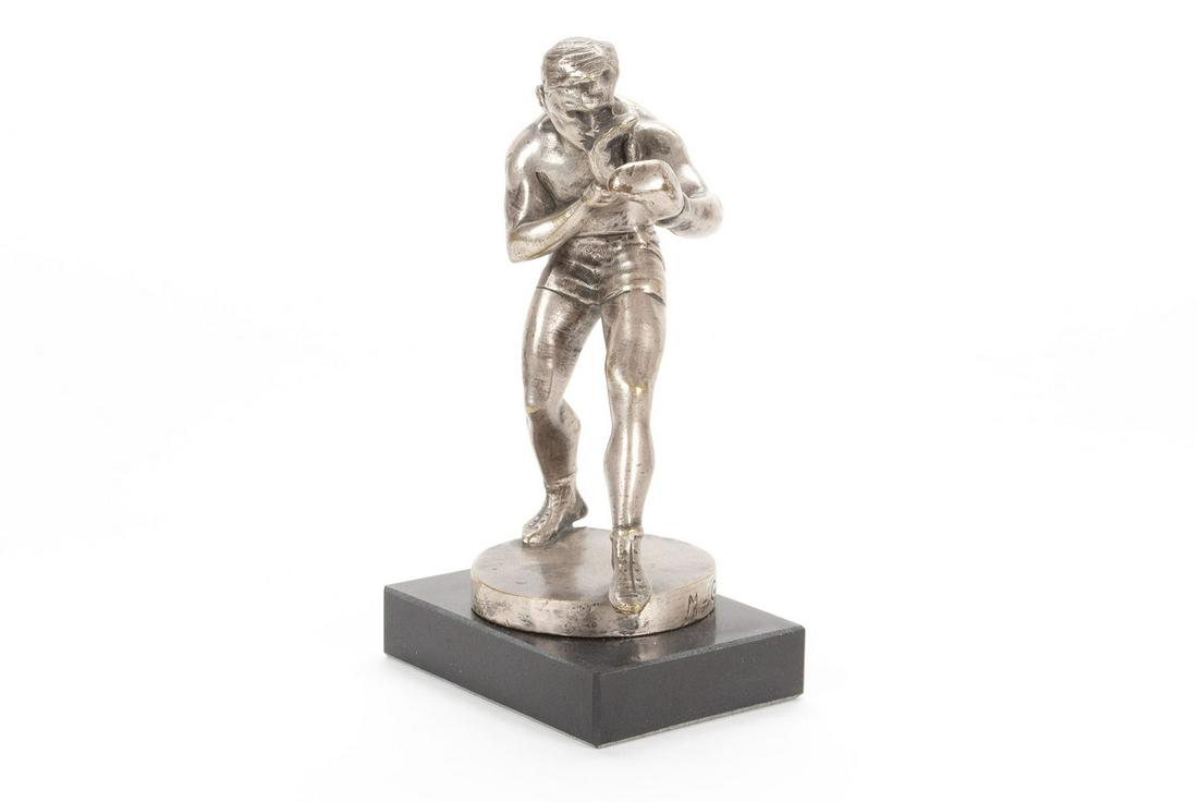 MAURICE GUIRAUD-RIVIERE BOXER STATUE HOOD ORNAMENT MASCOT: MAURICE GUIRAUD-RIVIERE BOXER STATUE HOOD ORNAMENT MASCOTFrance, ca.1930, signed silver finished bronze. Boxer in a fighting stance. 6.25" height; statue 5.5" height