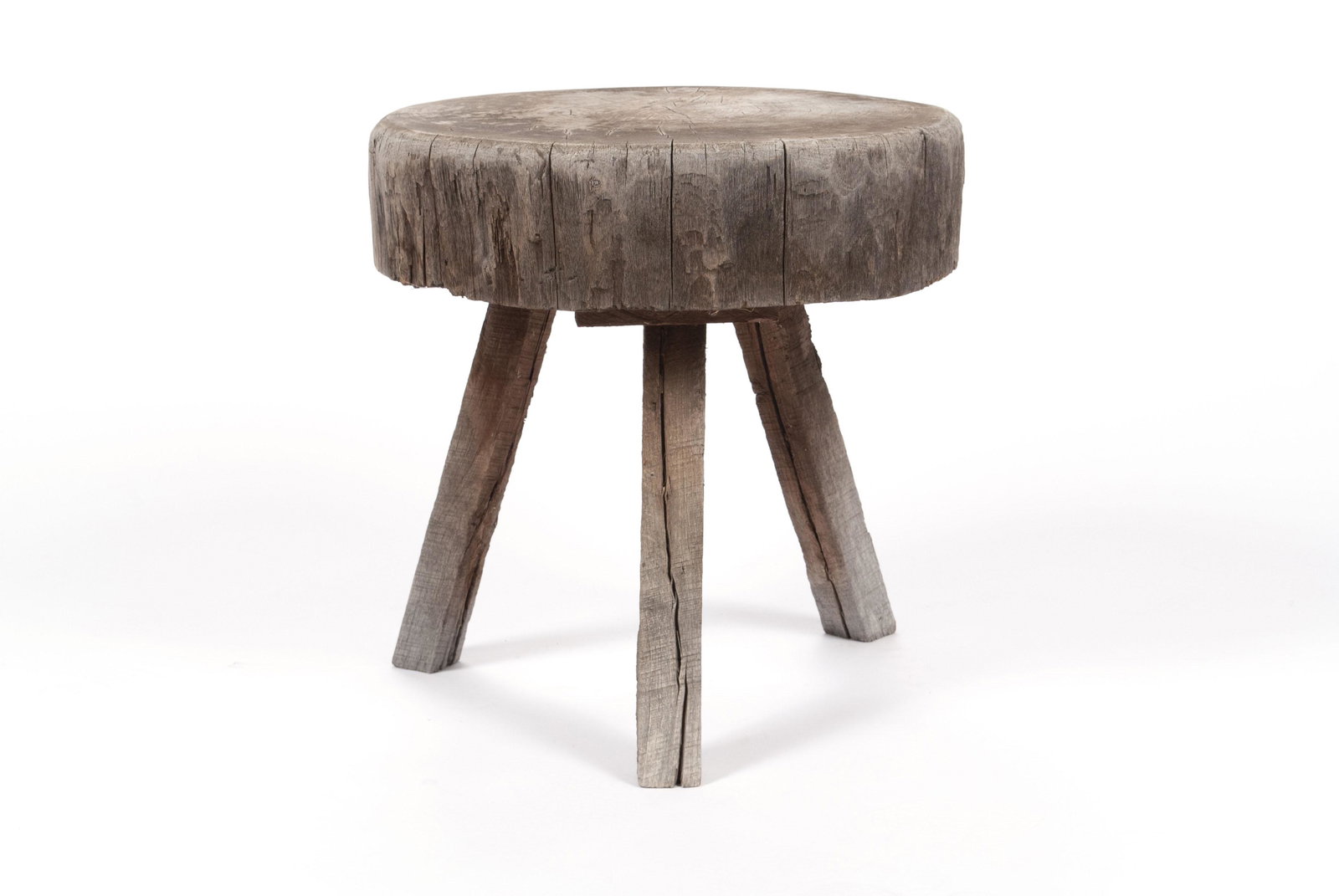 ORGANIC SIDE TABLE: ORGANIC SIDE TABLE America, early 20th century. A segment of raw tree serving as the base, elevated on three sprawling legs. 20" height, 18.5" diameter