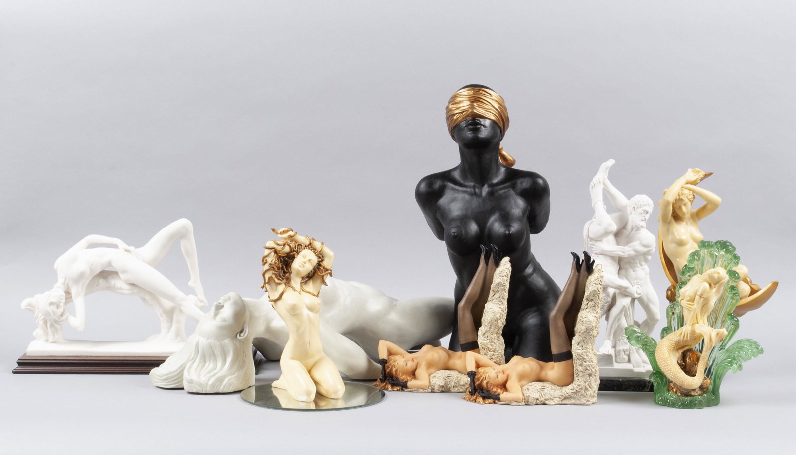 LARGE COLLECTION OF EROTICA SCULPTURES: LARGE COLLECTION OF EROTICA SCULPTURES Twentieth, twenty-first century, various materials. Two female nude sculptures for Toscano - one blindfolded, the other a wall mount; A. Santini, Italy arched fe