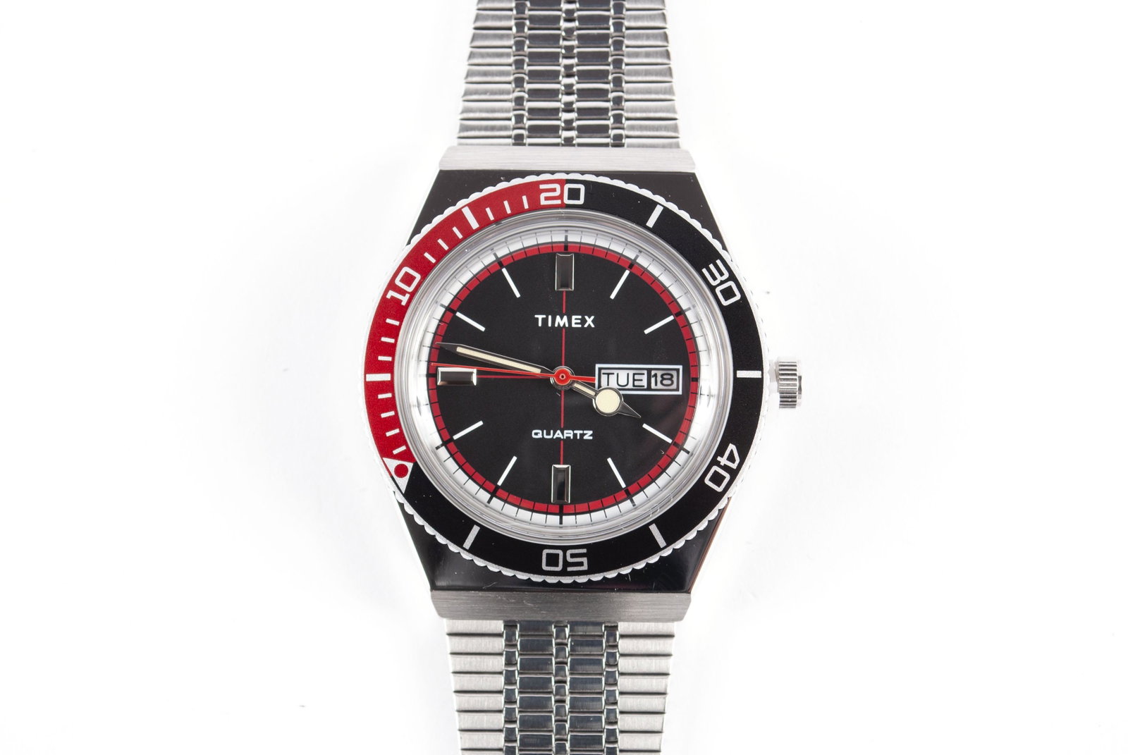 TIMEX QUARTZ FOR HUCKBERRY: TIMEX QUARTZ FOR HUCKBERRY China, water resistant to 50m, in stainless steel with "Coca-Cola" bezel, inset date feature, and stainless steel band. In original box with user's manual. 1.5" face diamete