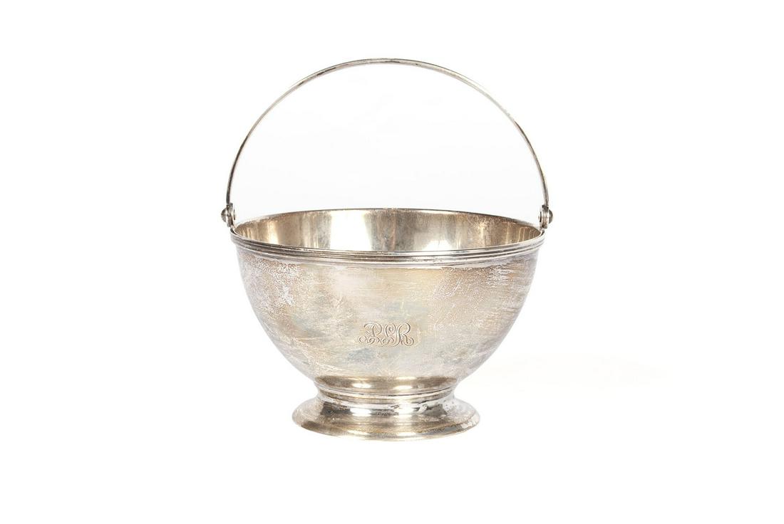 TIFFANY & CO DIMINUTIVE STERLING BASKET: TIFFANY & CO DIMINUTIVE STERLING BASKET American, 1907-1947. Circular footed with reeded handle. Hallmark to underside. 2.75 x 4.5 in diameter (6.99 x 11.43 cm); 220 grams
