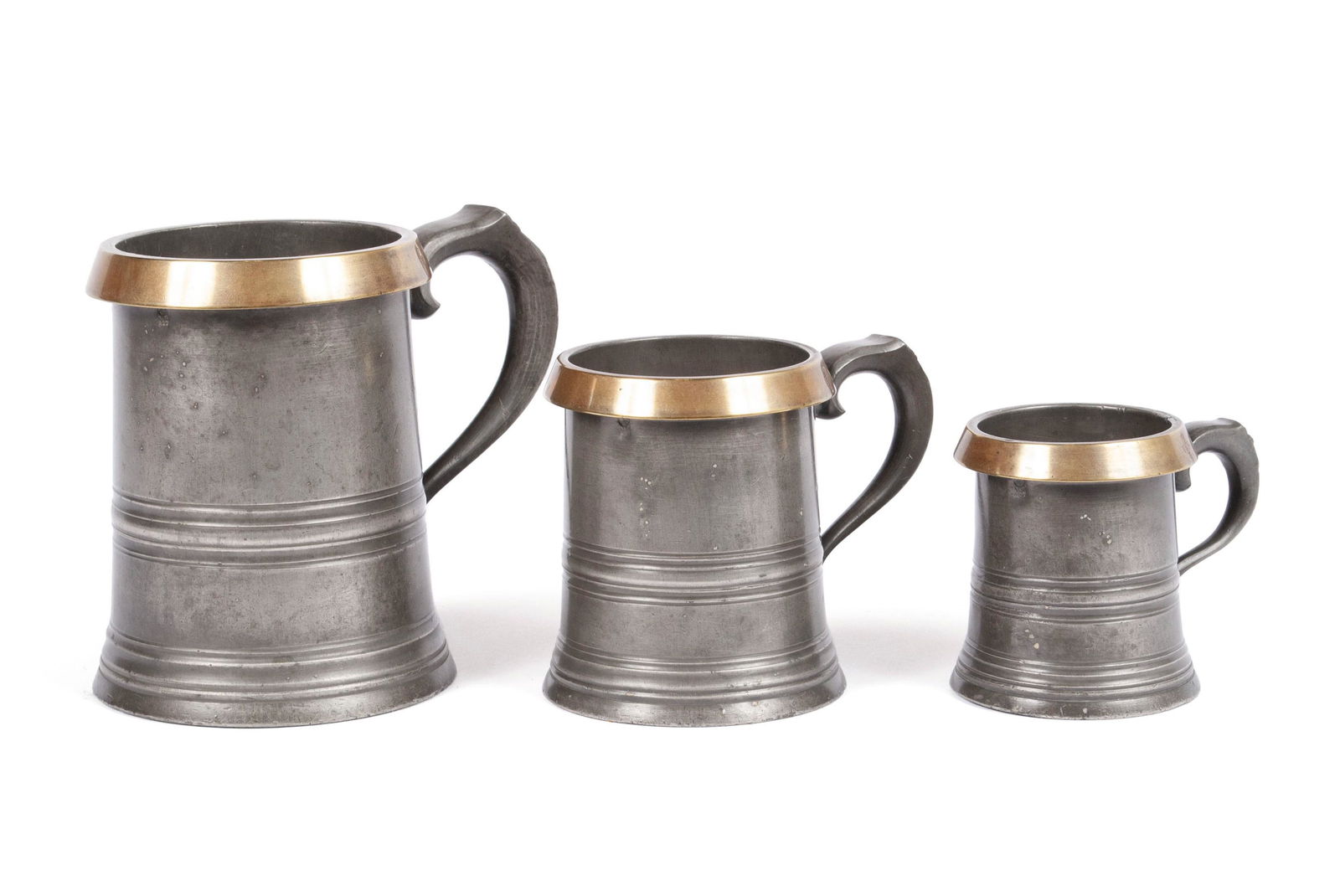 THREE VICTORIAN BRASS BOUND GRADUATED PEWTER MEASURES (1 of 6)
