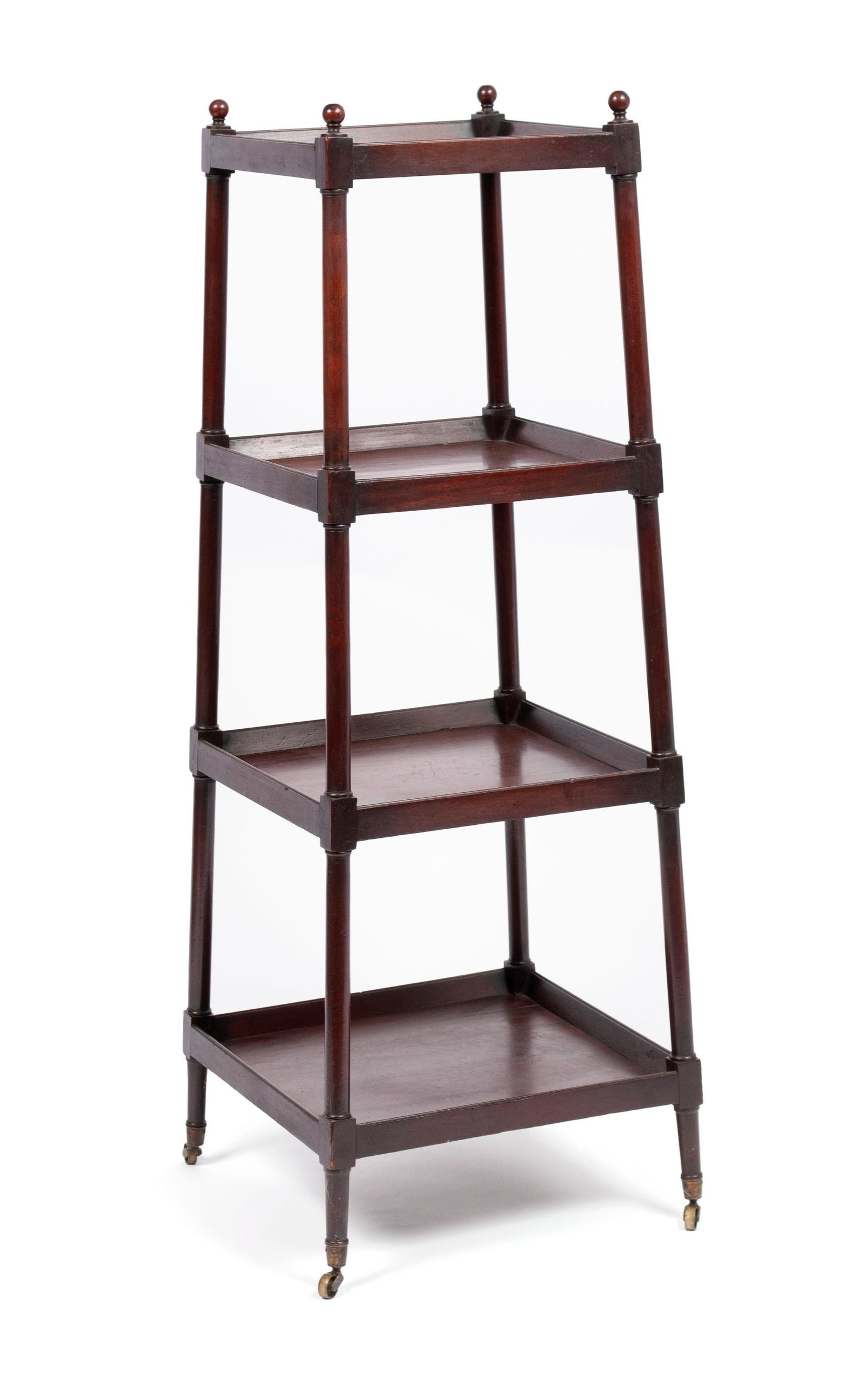 GEORGE III MAHOGANY WHATNOT SHELF: GEORGE III MAHOGANY WHATNOT SHELF England, late 19th century. Four-tiered etagere of tapering square form on brass casters. 49 1/2 x 15 1/4 x 15 1/4 in. (125.73 x 38.74 x 38.74 cm.)