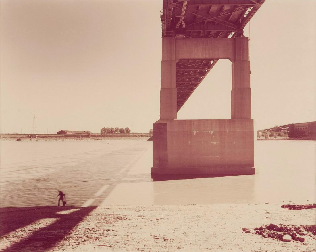 JOEL MEYEROWITZ (AMERICAN, B. 1938): Joel MeyerowitzAmerican, B. 1938 Bridge / River / Man: St. Louis and the ArchPhotographTitle, dated 1977, neg. # 107, and edition 2/15 on verso along with US Bank Visual Arts Department identification