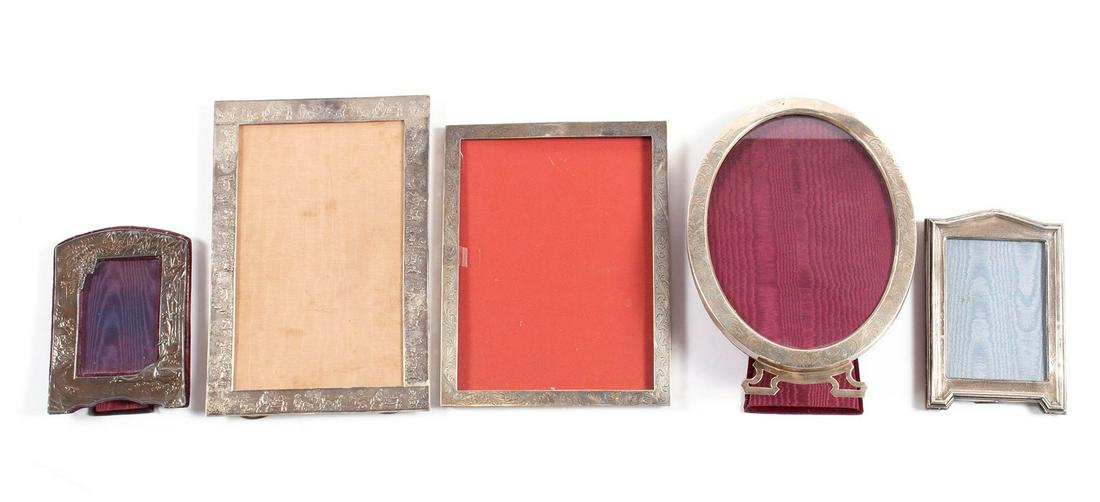 COLLECTION OF DECORATIVE PICTURE FRAMES - SILVER: COLLECTION OF DECORATIVE PICTURE FRAMES - SILVERFive (5) total frames including an oval sterling; etched sterling; John Bull of London 3 Goose repousse; an Edwardian silver architectural; and an Itali